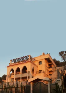 A residential villa consists of three stories and two basements containing a 370 square meter garage and a technical floor. we used the Islamic sharp arches and decorated columns in addition to stone stair railing and pitched brick roofs. The structural system was a simple and economic we considered the climate and local conditions when we chose the plants and materials.